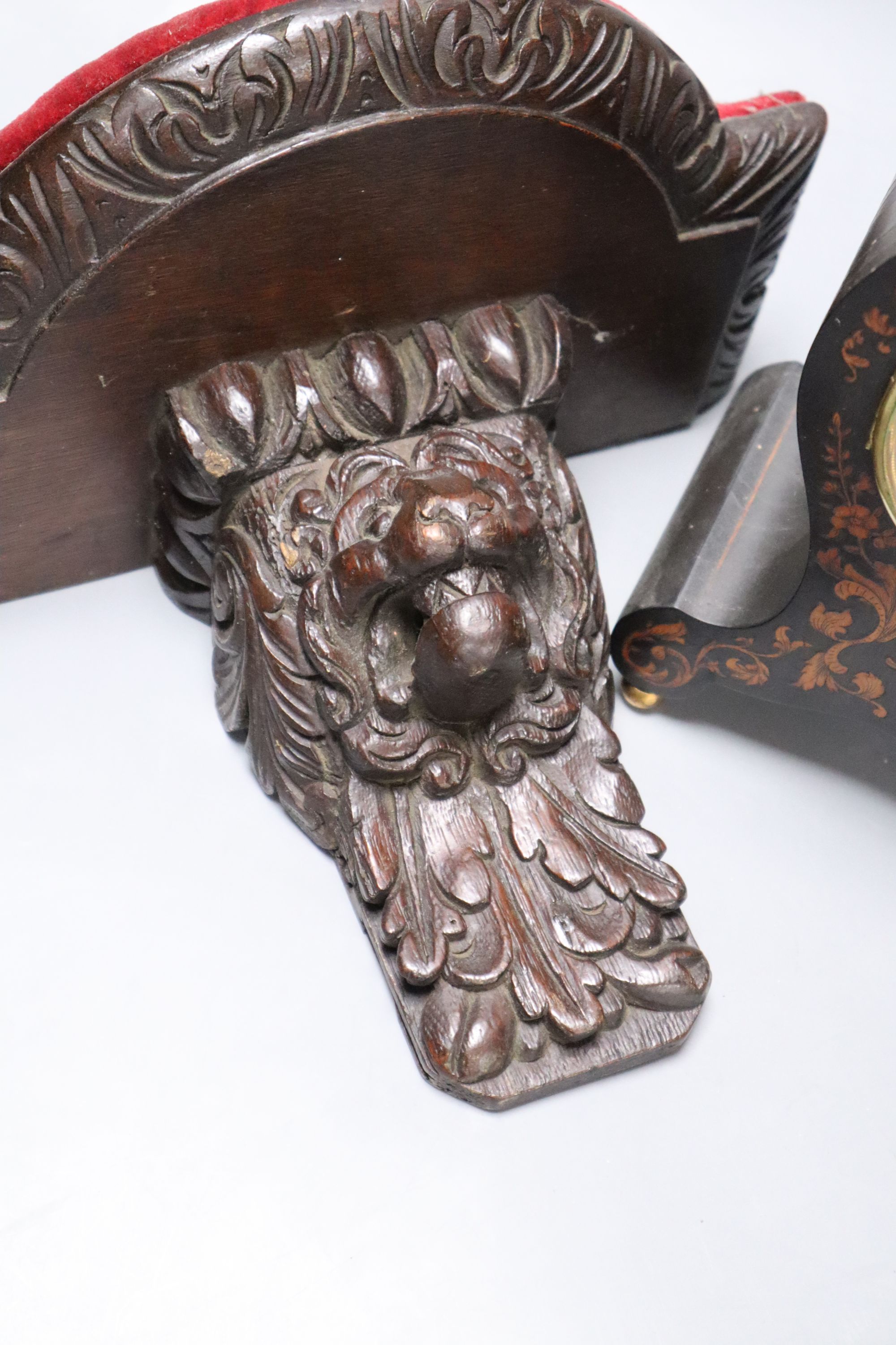 A 19th century marquetry inlaid mantel clock, height 23cm, together with a carved oak bracket